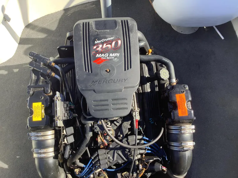 Slide: The Image of MerCruiser 350 MAG MPI engine in a 2002 Tigé 22i boat, top view. - 38