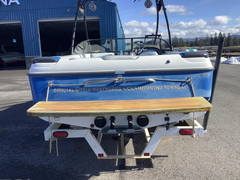 Slide: The Image of 2002 Tigé 22i boat, rear view, labeled "Official World Wakeboard Championship Towboat." - 9