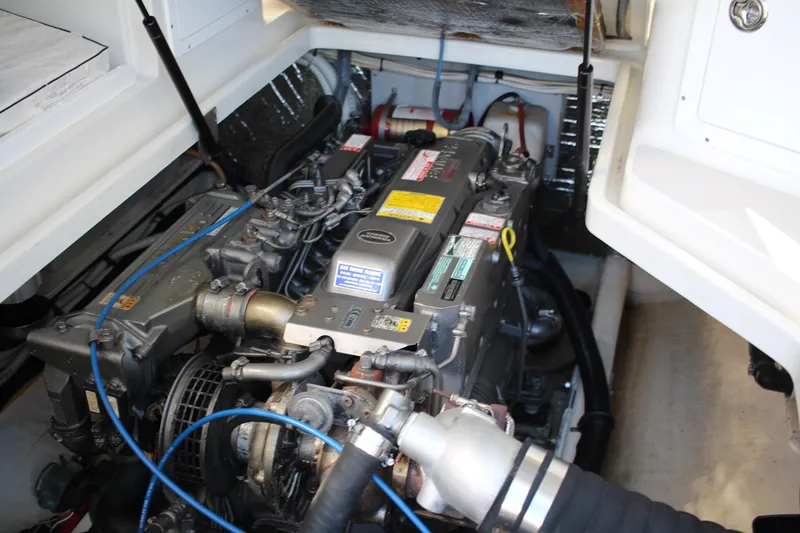 Slide: The Image of Engine compartment of a 2007 Back Cove 29 boat, showcasing detailed mechanical components. - 13