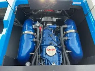 Slide: The Image of 2023 MasterCraft NXT22 engine with blue Ilmor components. - 3