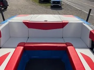 Slide: The Image of 2023 MasterCraft NXT22 boat interior with red and white seating. - 5
