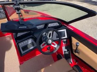 Slide: The Image of 2024 MasterCraft NXT22 boat interior with modern dashboard and steering wheel. - 6