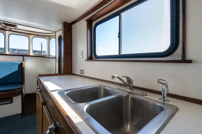 Slide: The Image of Interior of 1980 Commercial Troller with dual sink and window view. - 10