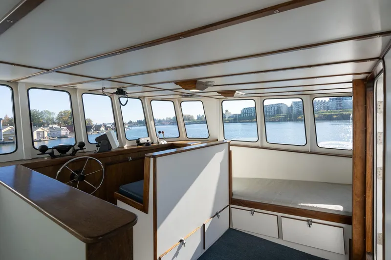 Slide: The Image of Interior of 1980 Commercial Troller boat with panoramic windows and seating area. - 19