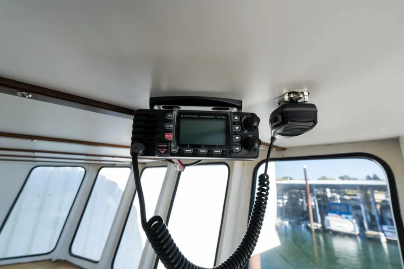 Slide: The Image of Ceiling-mounted marine radio in a 1980 Commercial Troller boat cabin. - 29