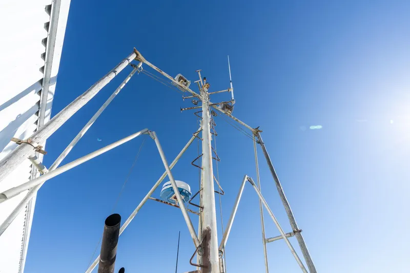 Slide: The Image of Fishing boat mast against clear blue sky, Commercial Troller, 1980 model. - 38