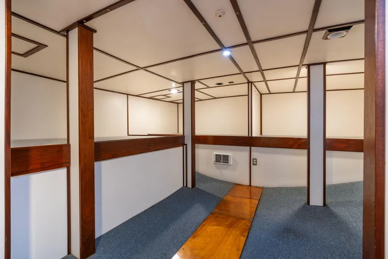 Slide: The Image of Interior of a 1980 Commercial Troller with wood accents and blue carpet. - 49