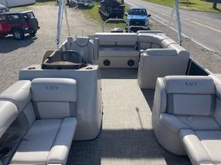 Slide: The Image of 2019 Harris FloteBote Cruiser 220 pontoon boat with spacious seating and modern design. - 2