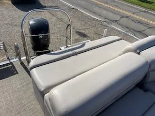 Slide: The Image of 2019 Harris FloteBote Cruiser 220 pontoon boat with comfortable seating and outboard motor. - 3