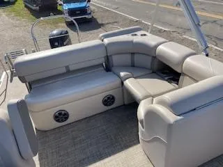 Slide: The Image of 2019 Harris FloteBote Cruiser 220 interior with plush seating and built-in speakers. - 4