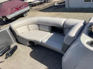 Slide: The Image of 2019 Harris FloteBote Cruiser 220 interior seating, beige upholstery, outdoor setting. - 6
