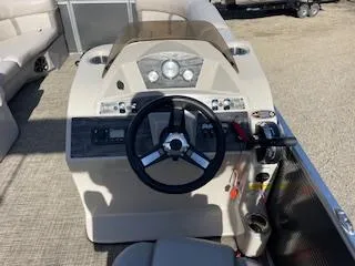 Slide: The Image of 2019 Harris FloteBote Cruiser 220 dashboard with steering wheel and controls. - 7