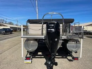 Slide: The Image of 2019 Harris FloteBote Cruiser 220 pontoon boat with 115 HP engine, parked on trailer. - 8
