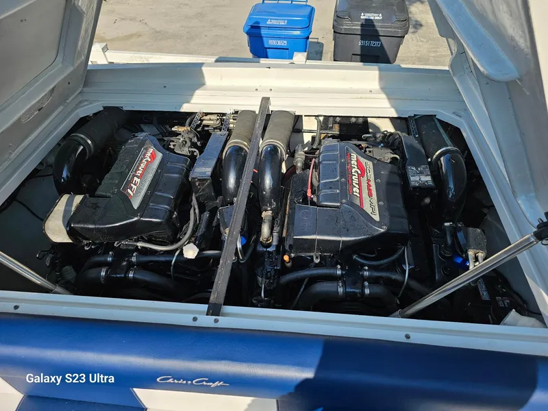 Slide: The Image of 1983 Chris-Craft 312 SL boat engine compartment with dual engines, open hatch. - 5