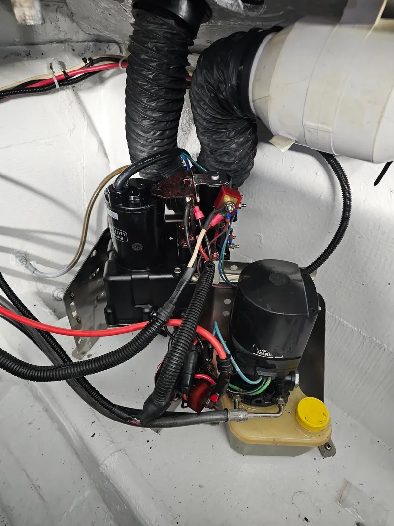 Slide: The Image of 1983 Chris-Craft 312 SL engine compartment with wiring and components. - 8