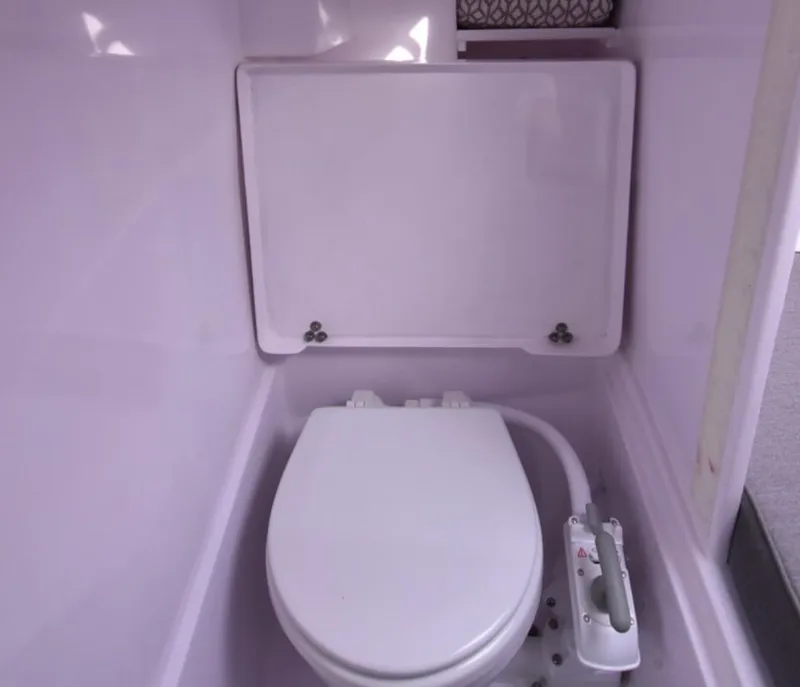 Slide: The Image of Compact bathroom in 2025 Corsair 970 model, featuring a modern white toilet. - 4
