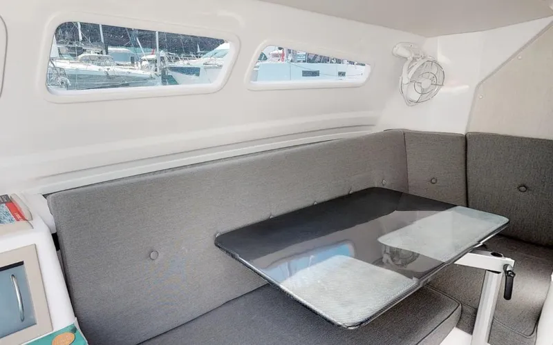 Slide: The Image of Modern interior of 2025 Corsair 970 sailboat with sleek seating and table. - 5