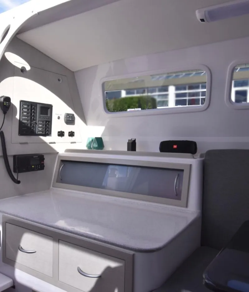 Slide: The Image of Interior of 2025 Corsair 970 sailboat, featuring modern navigation equipment and sleek design. - 7
