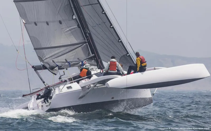 The Image of Sailing Corsair 970 trimaran on open water, 2025 model, crew in life jackets. - 0