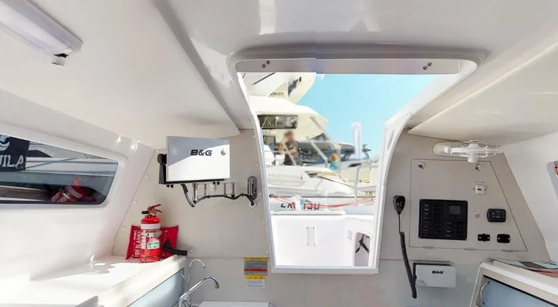 Slide: The Image of Interior of 2025 Corsair 970 sailboat, featuring navigation equipment and modern amenities. - 6