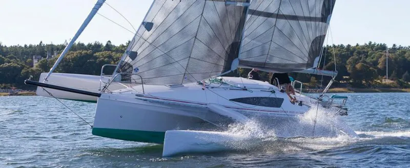 Slide: The Image of 2025 Corsair 970 Sport sailing on water, showcasing sleek design and performance. - 3