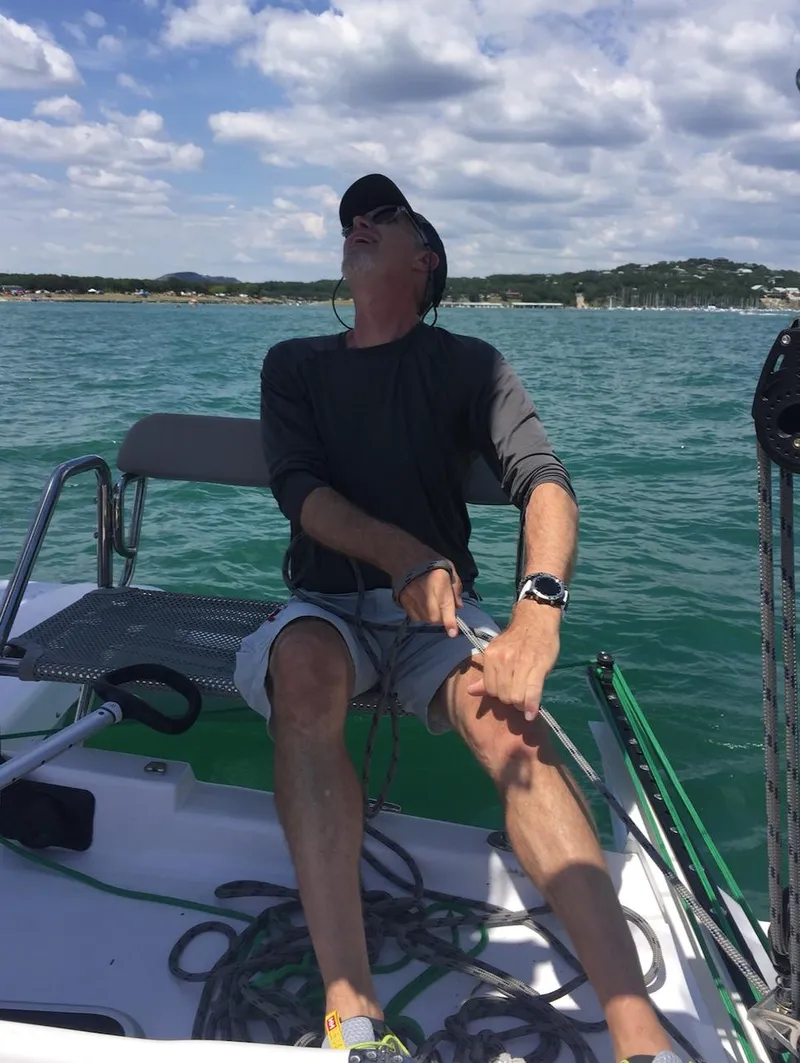 Slide: The Image of Man sailing Corsair 970 Sport, 2025 model, on a sunny day. - 11