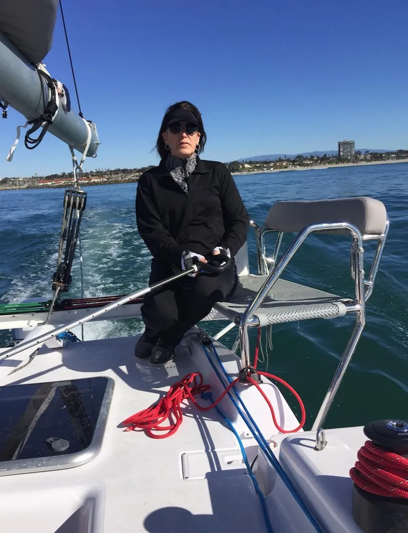 Slide: The Image of Person sailing Corsair 970 Sport boat on sunny day, 2025 model. - 14