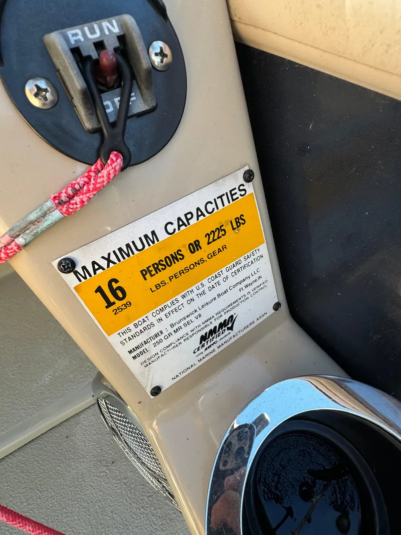 Slide: The Image of Capacity label on 2011 Harris 250GMSE boat, max 16 persons or 2225 lbs. - 12