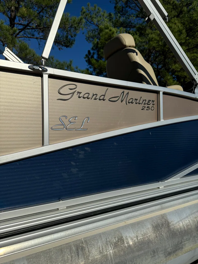 Slide: The Image of 2011 Harris Grand Mariner 250 SEL pontoon boat, side view with trees in background. - 14