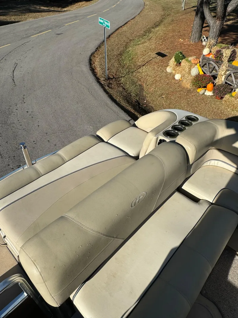 Slide: The Image of 2011 Harris 250GMSE boat seats near a road and autumn decorations. - 6