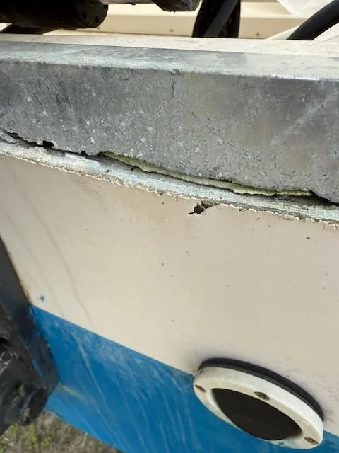 Slide: The Image of Damaged hull of 2000 Grady-White 222 FISHERMAN boat showing cracks and wear. - 3