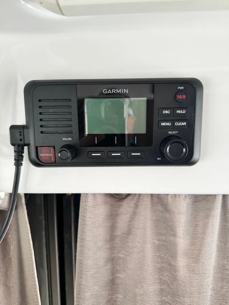 Slide: The Image of Garmin marine radio on 2019 Jeanneau NC 895 boat dashboard. - 11