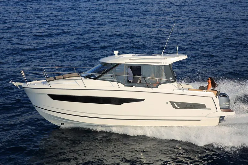 Slide: The Image of 2019 Jeanneau NC 895 cruising on open water. - 15