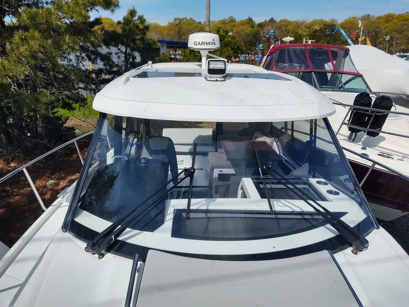 Slide: The Image of 2019 Jeanneau NC 895 boat with Garmin radar, docked outdoors. - 3