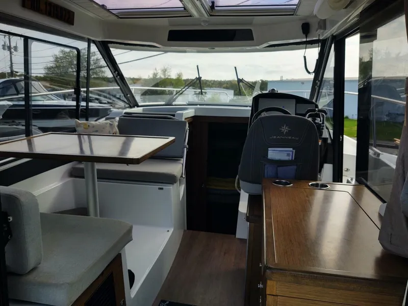 Slide: The Image of Interior of 2019 Jeanneau NC 895 boat with seating and table. - 5
