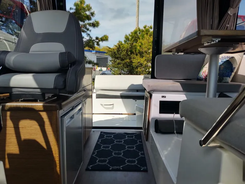 Slide: The Image of Interior of 2019 Jeanneau NC 895 boat with seating and modern design. - 6