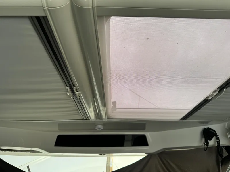 Slide: The Image of Interior view of 2019 Jeanneau NC 895 boat's sunroof and ceiling details. - 7