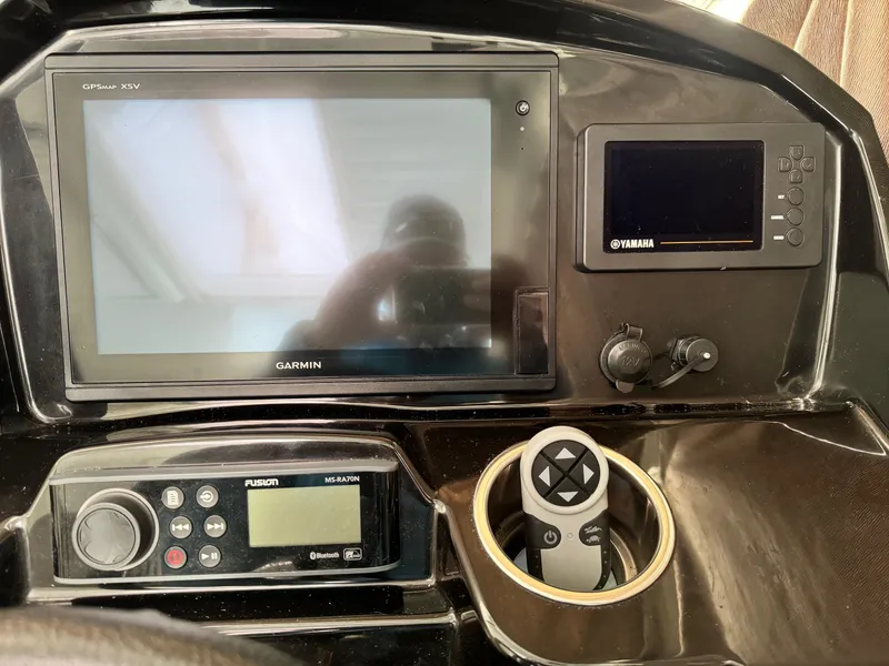 Slide: The Image of 2019 Jeanneau NC 895 dashboard with Garmin GPS, Yamaha display, and Fusion audio system. - 8