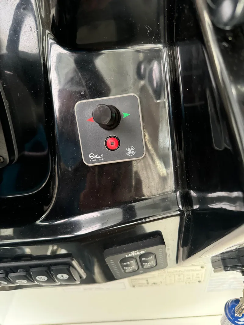 Slide: The Image of Control panel of a 2019 Jeanneau NC 895 boat with joystick and buttons. - 9