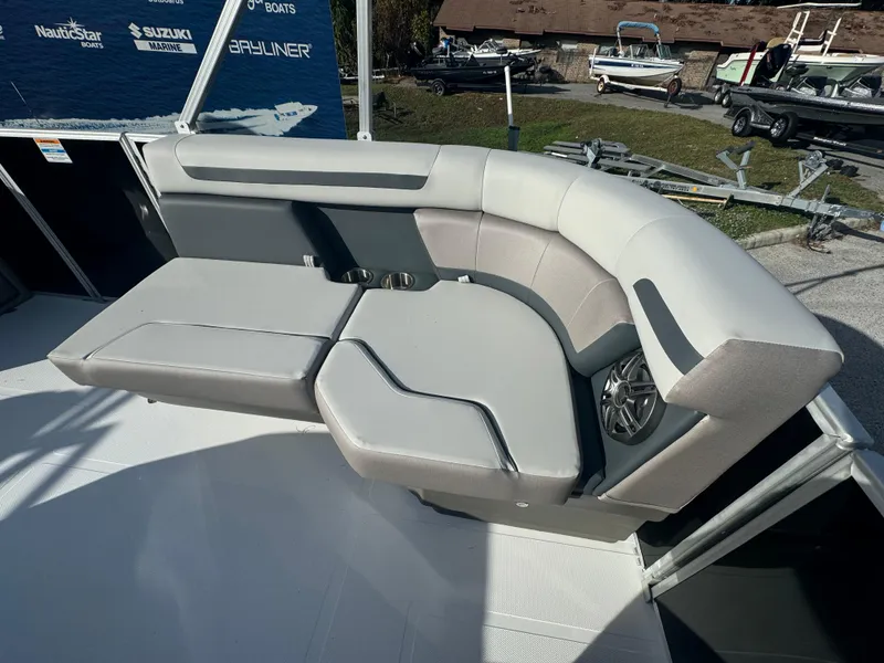 Slide: The Image of 2024 Hurricane FunDeck 2260 RE boat seating with gray upholstery and speaker. - 12