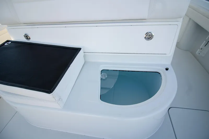 Slide: The Image of 2024 Yellowfin 39 boat interior with storage compartment and cutting board. - 11