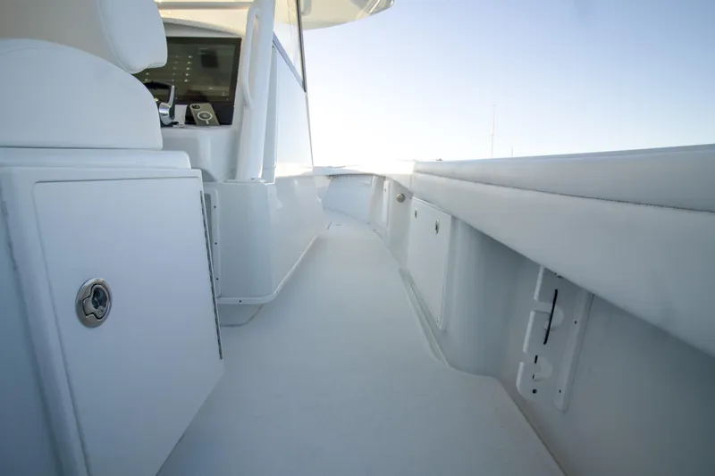 Slide: The Image of 2024 Yellowfin 39 boat interior with sleek white design and modern controls. - 13