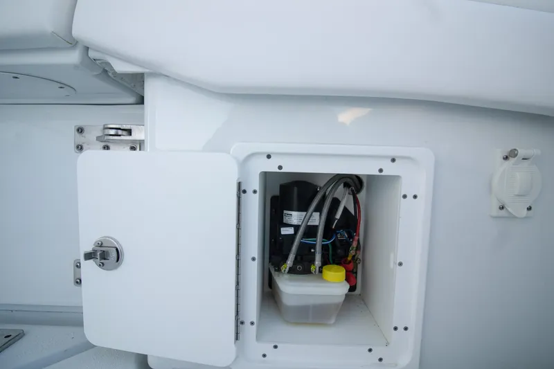 Slide: The Image of Open compartment on 2024 Yellowfin 39 boat showing internal wiring and components. - 14