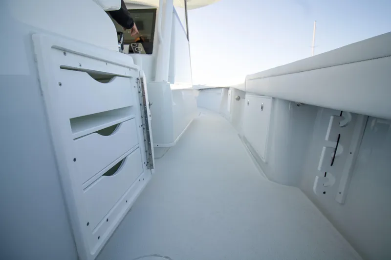 Slide: The Image of 2024 Yellowfin 39 boat interior with storage compartments and sleek design. - 15