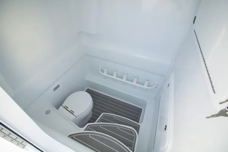 Slide: The Image of 2024 Yellowfin 39 boat interior with toilet and storage space. - 16