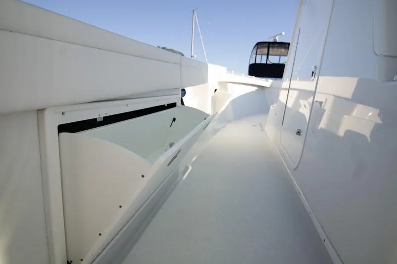 Slide: The Image of 2024 Yellowfin 39 boat deck with sleek white design and spacious walkway. - 7