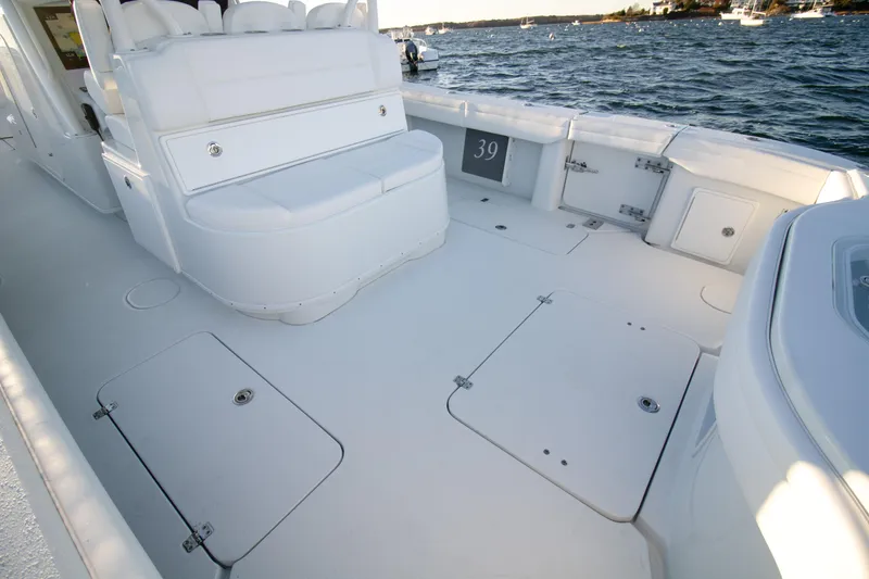 Slide: The Image of 2024 Yellowfin 39 boat deck with seating, on a sunny day at sea. - 8