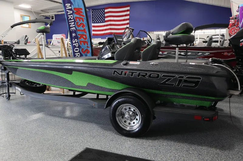 The Image of 2025 Nitro Z19 boat displayed in showroom with festive decorations. - 0