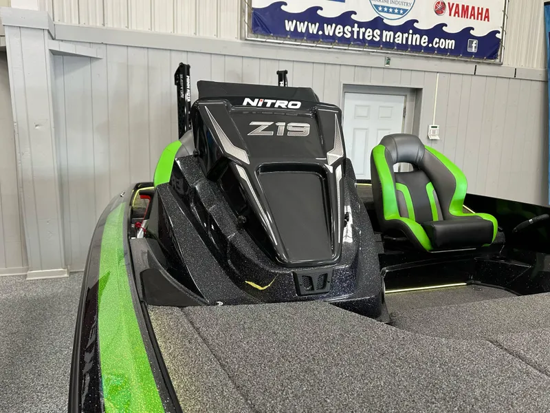 Slide: The Image of 2025 Nitro Z19 boat interior with green accents and storage compartments. - 10