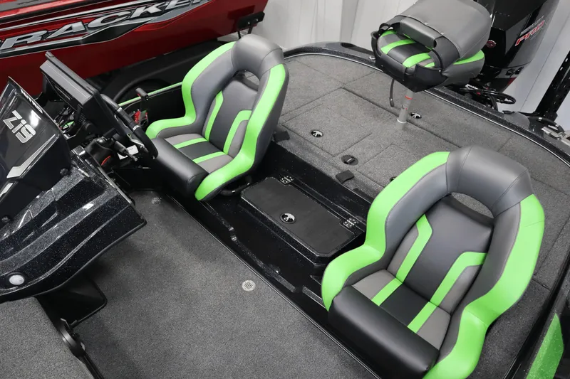 Slide: The Image of 2025 Nitro Z19 boat interior with steering wheel, control panel, and green-accented seat. - 15